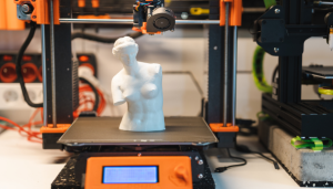 a 3d printer creating a replica of the Venus de Milo statue
